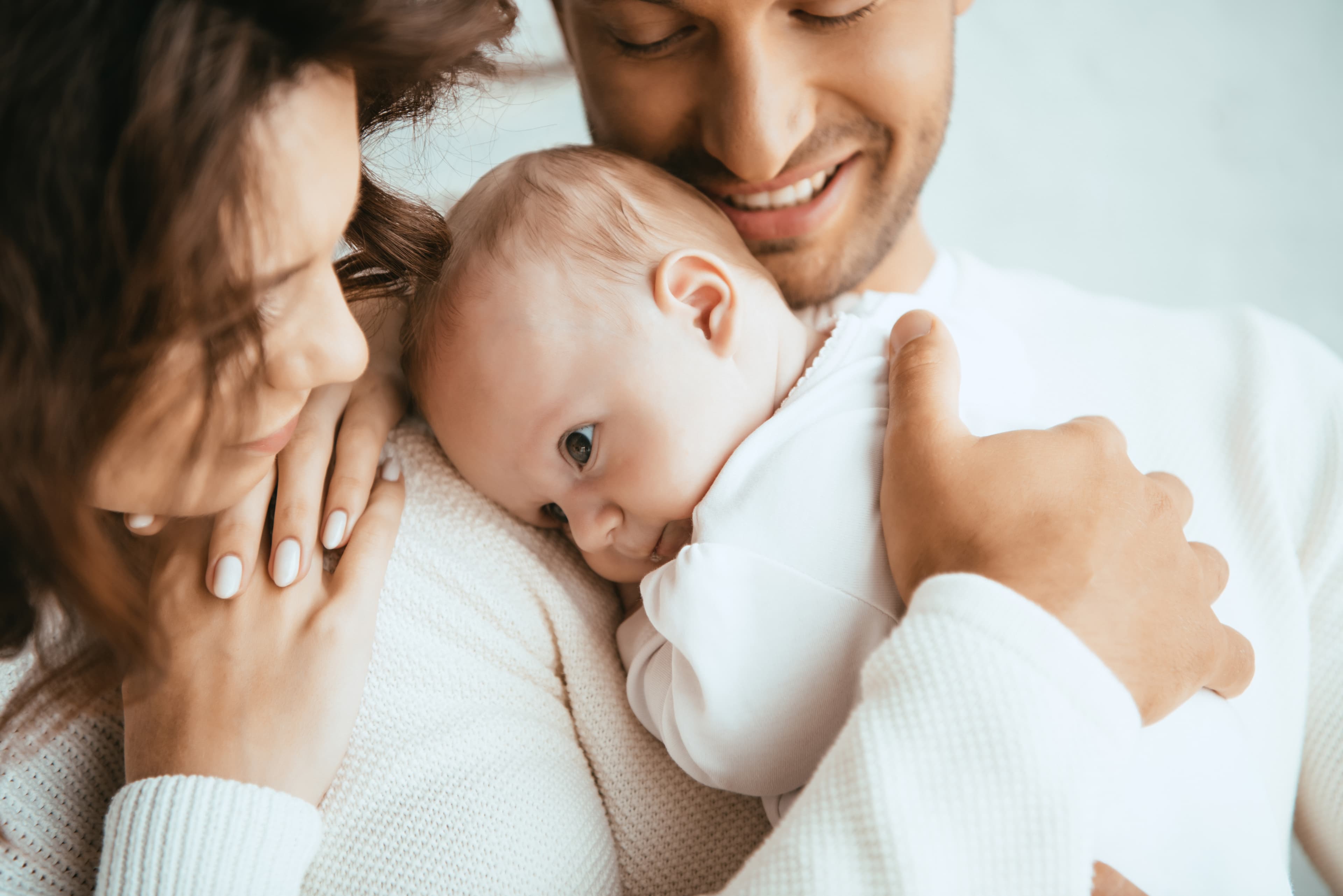 Parents holding their newborn baby