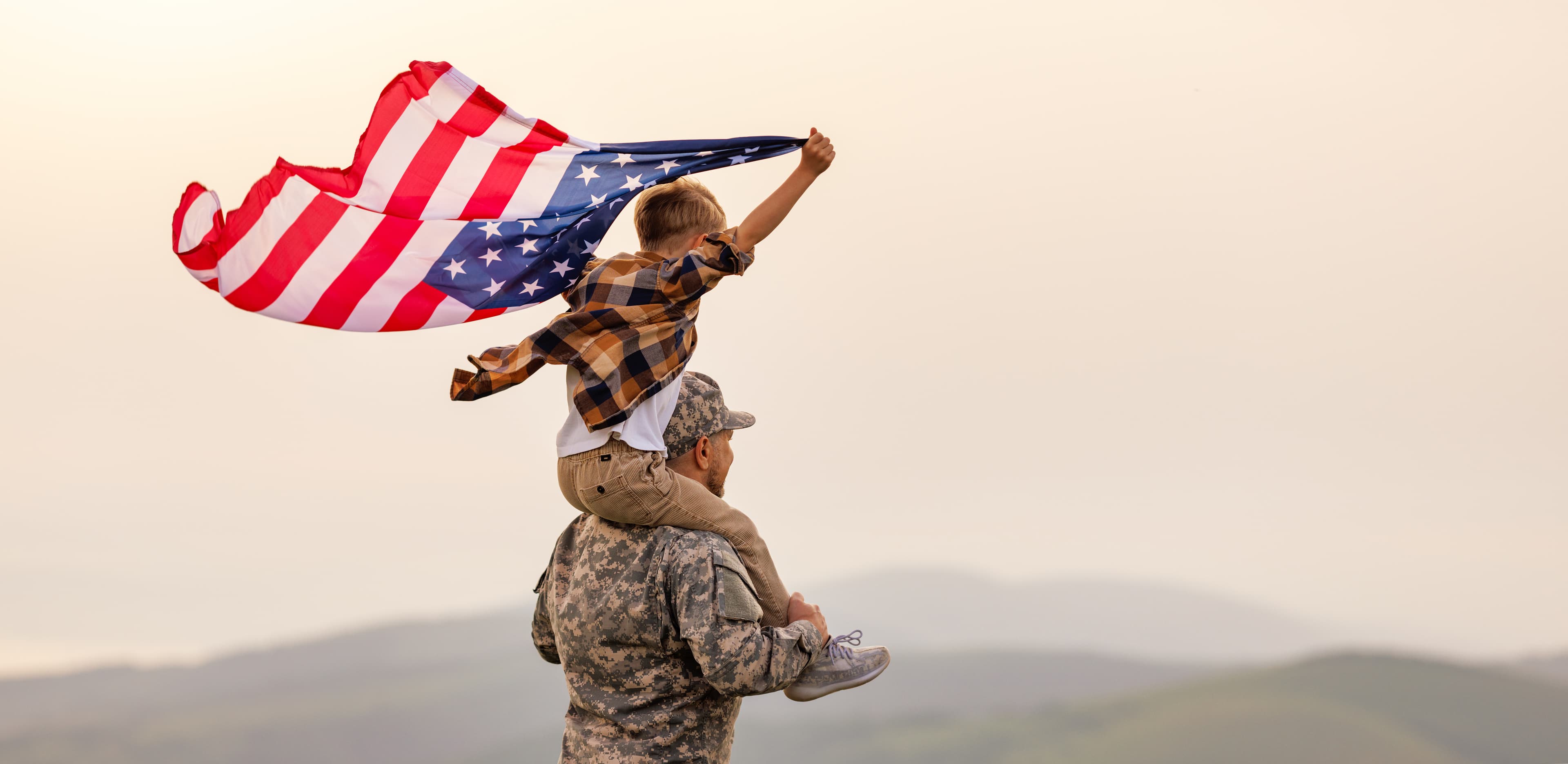 Child holding an American flag