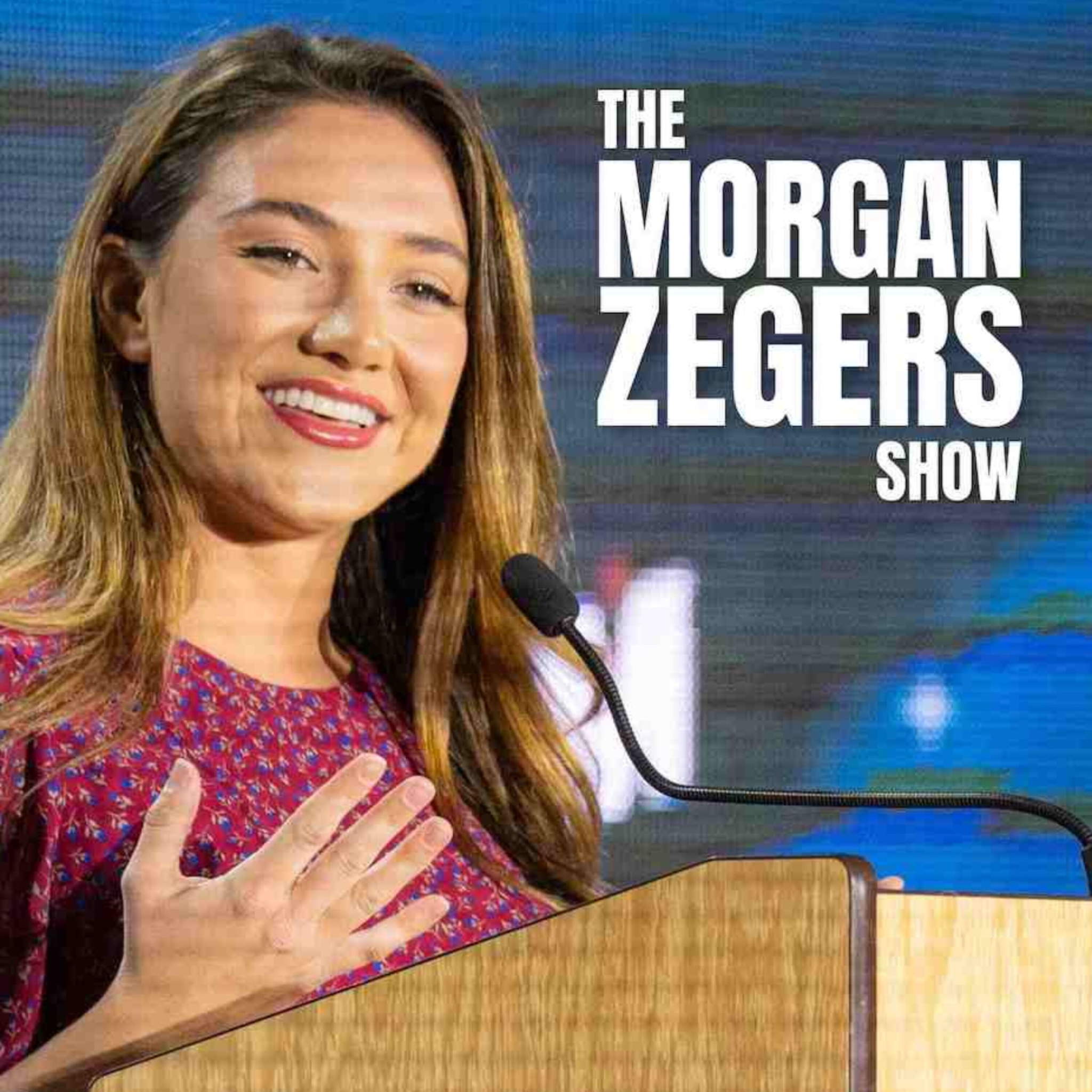 Morgan Zegers smiles at a podium